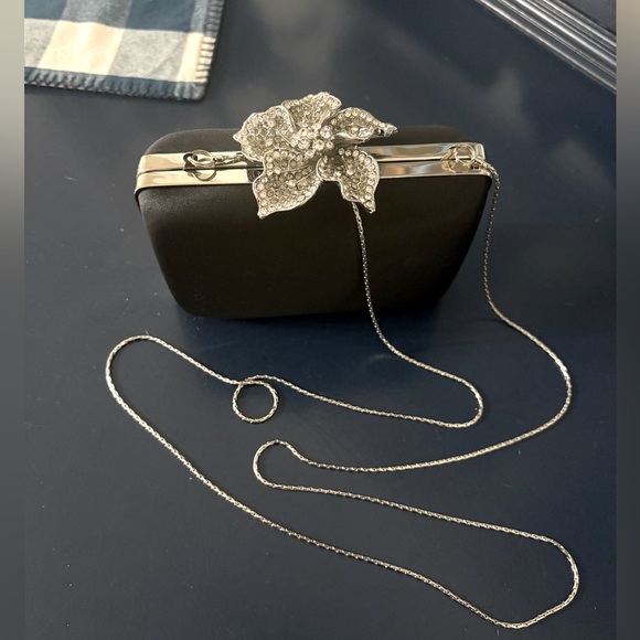 Cache Elegant Black Clutch with Silver Chain &  Diamond Embellished Flower Decor - Picture 1 of 7